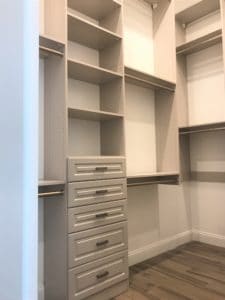 Hers Walk-In Closet with Triple Hanging Rods