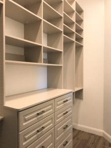 HIS WALK-IN CLOSET WITH HUTCH AND OPEN SHELVING