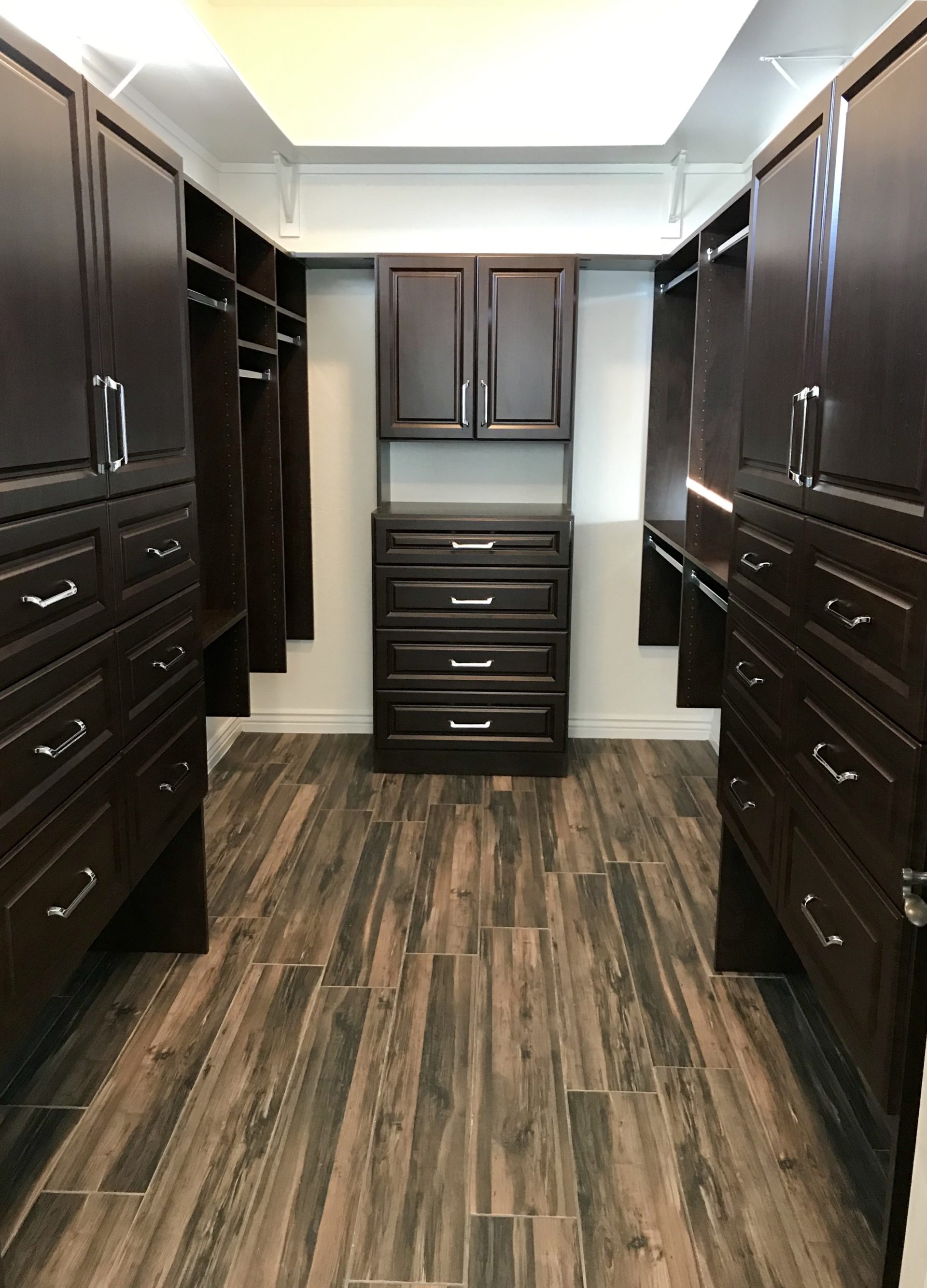 COCOA MASTER CLOSET WITH RAISED PANEL DOORS | Austin-Morgan Closets