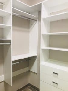 SMALL WALK-IN CLOSET in white finish by Austin-Morgan Closets